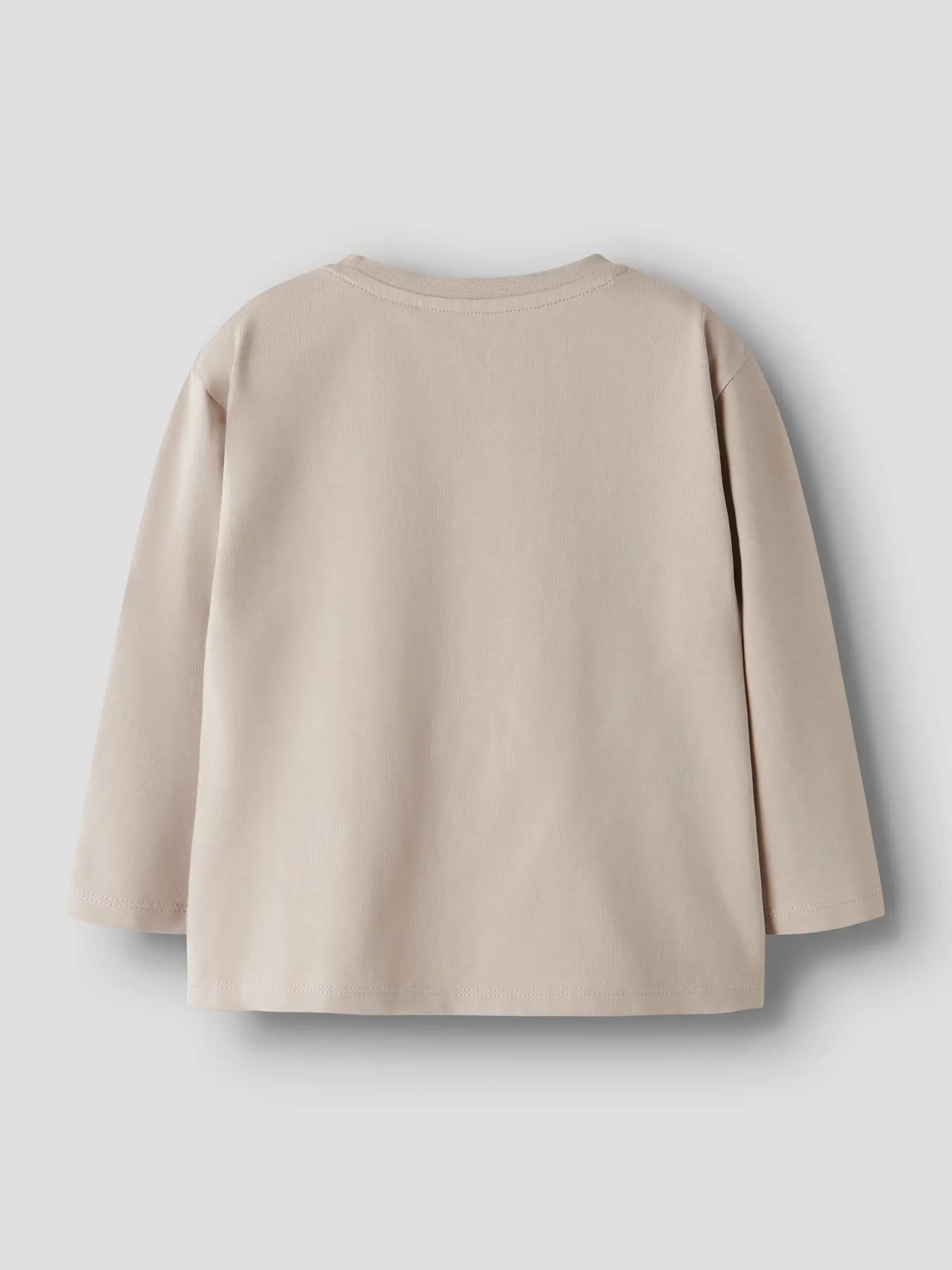 Beige tröja med betongbil
