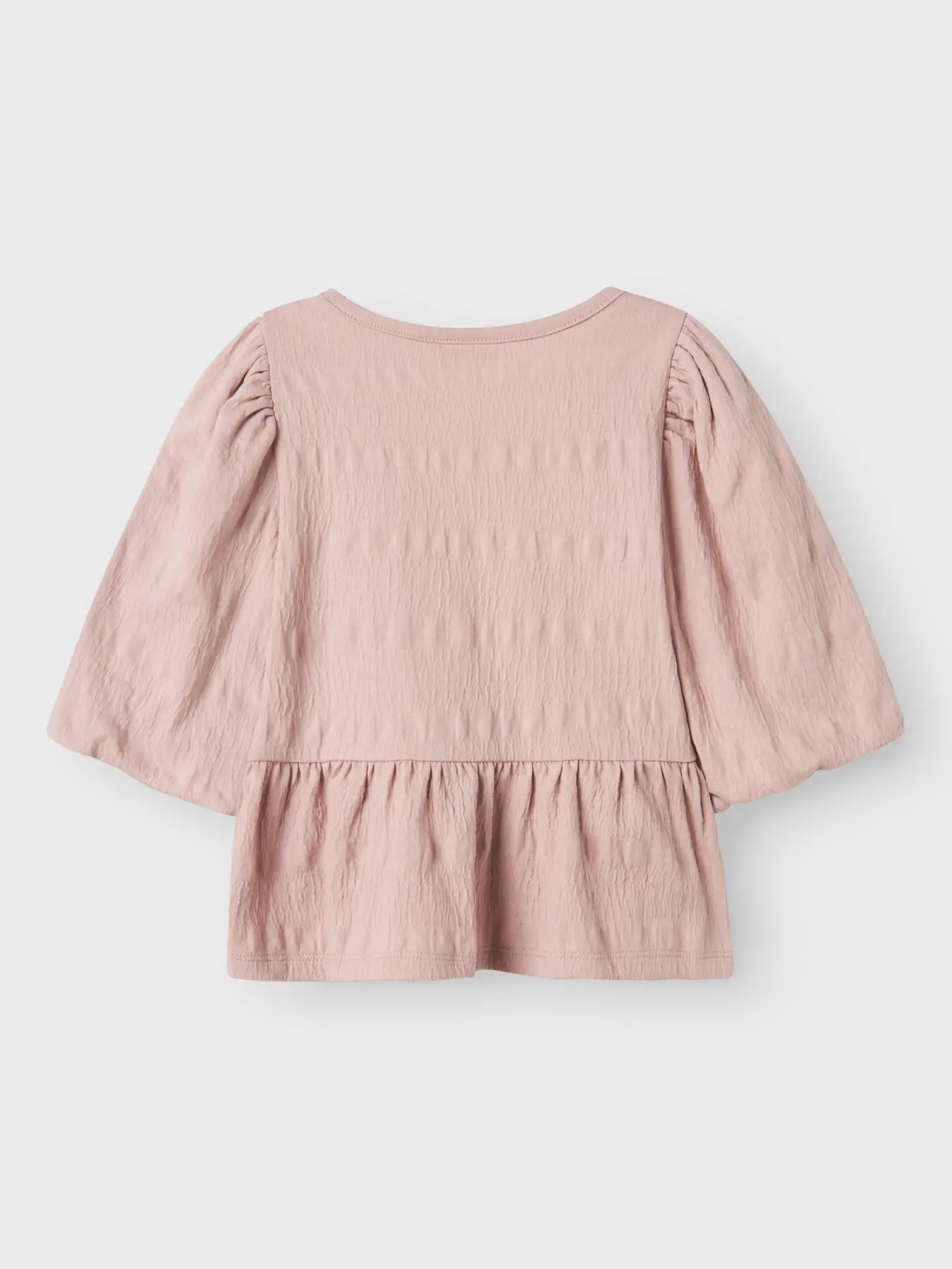 Blus med rosetter